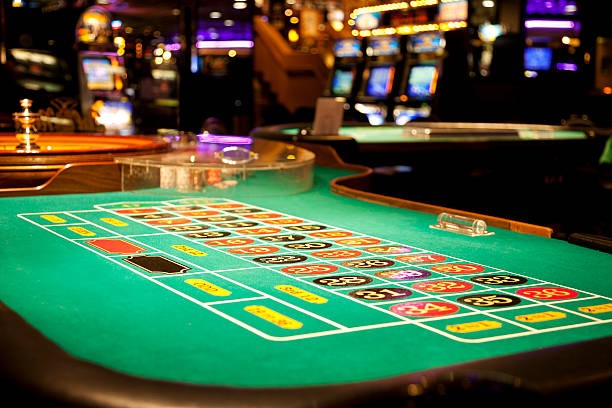 Mobile phone displaying live casino table interface